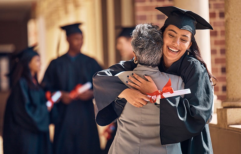 A graduated student hugs to her teacher